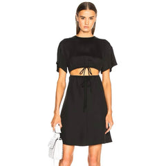 Woman wearing a black dress with a white background