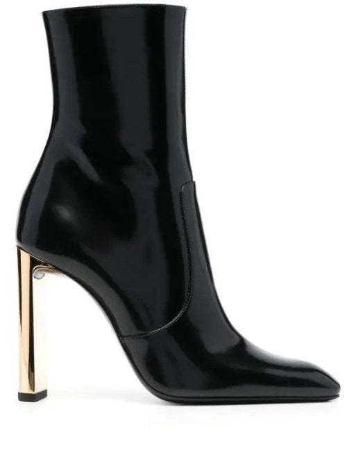 Black high-heeled ankle boot with gold heel on a white background