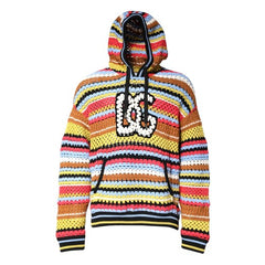 A colorful crocheted hoodie with horizontal stripes in yellow, orange, red, pink, blue, and black, featuring a large white and black crochet 'DC' logo on the chest.