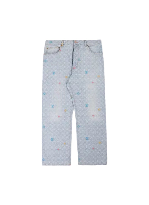 Light blue denim jeans with an all-over repeating monogram pattern and small scattered multicolor embroidered accents, laid flat against a light beige background.