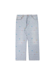 Light blue denim jeans with an all-over repeating monogram pattern and small scattered multicolor embroidered accents, laid flat against a light beige background.