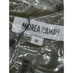Andrea Iyamah label on a garment in clear plastic packaging