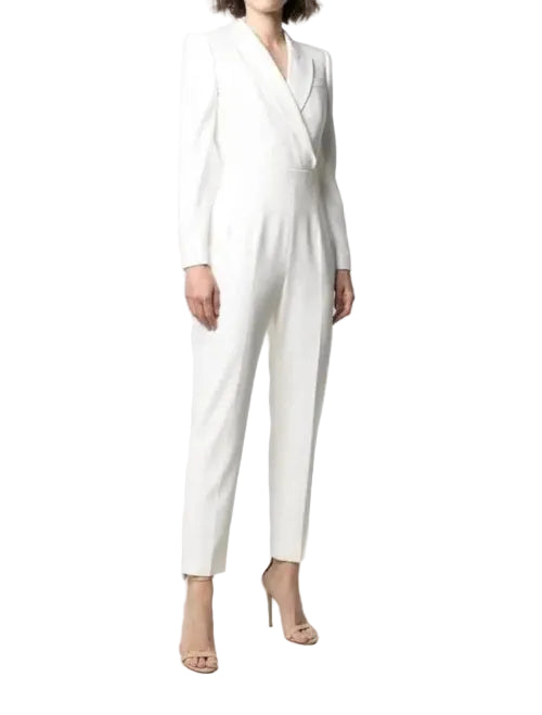 White jumpsuit worn by a person on a white background