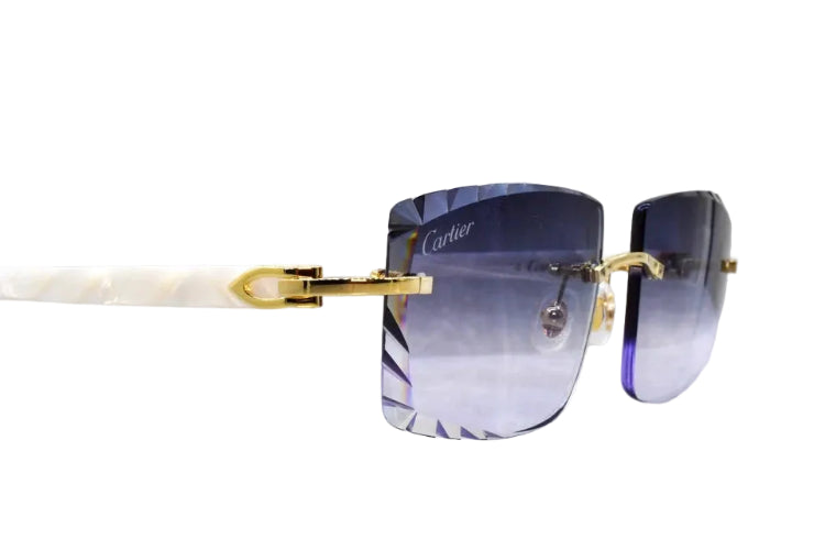 Two black cylindrical objects with gold accents on a white background