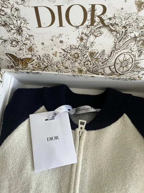 Dior sweater with a Dior tag on a decorative box