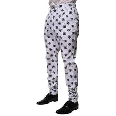 White pants with black pattern worn by a person on a white background