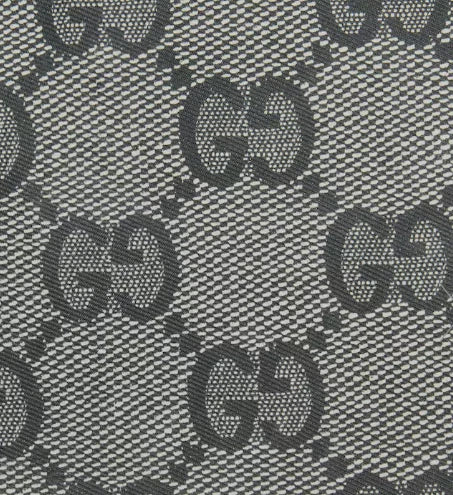 Patterned fabric with a repeated logo design on a gray background