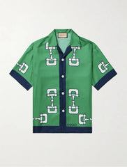 Green shirt with white pattern on a light gray background