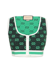Green and black patterned Gucci bag on a white background