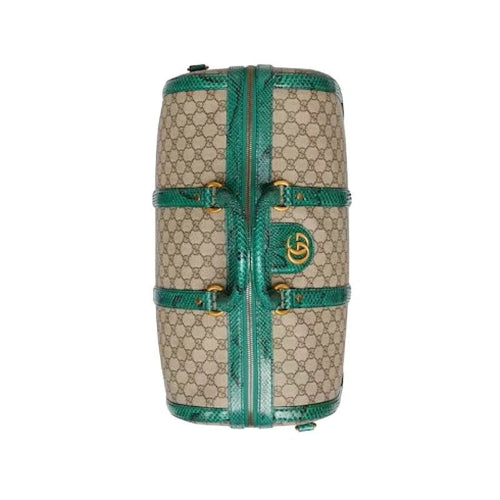 Designer handbag with green accents on a white background