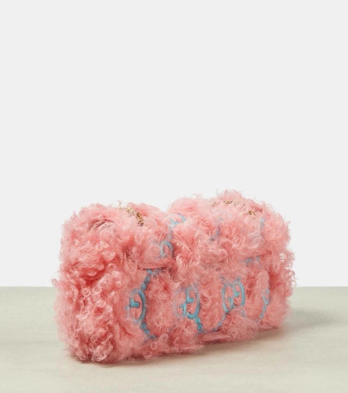 Pink textured product with decorative elements on a light background