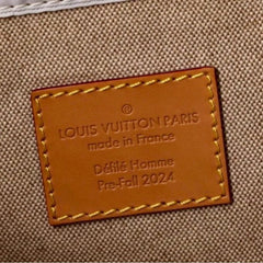 Louis Vuitton label on a textured beige background
