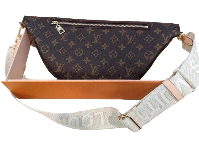 Designer waist bag with monogram pattern on a light background