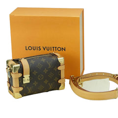Louis Vuitton handbag with monogram pattern and gold accents on a light blue background