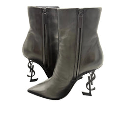 Pair of gray high-heeled boots with brand logo on a white background