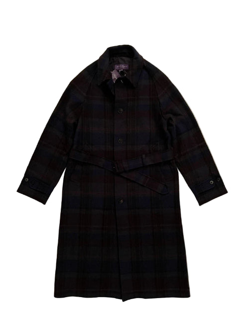 Black checkered coat on a beige background