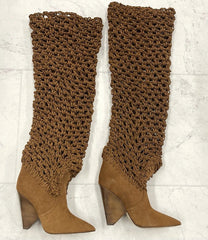 Brown knee-high boots with textured leg warmers on a white background