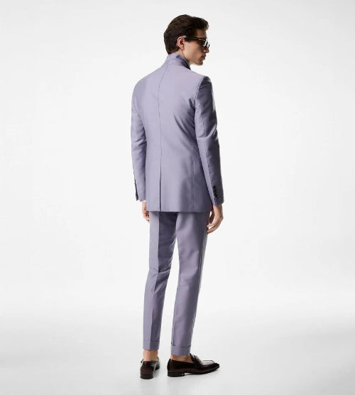 Man wearing a light gray suit on a white background