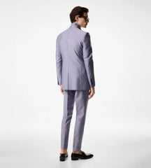 Man wearing a light gray suit on a white background
