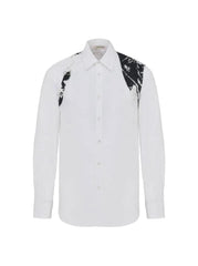 A white long-sleeve button-up shirt with black and white marble-patterned shoulder panels, shown against a plain white background.
