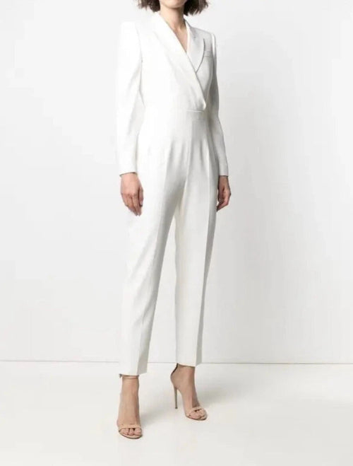 White jumpsuit worn by a person on a white background