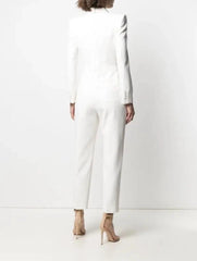 Person wearing a white long-sleeve dress against a white background
