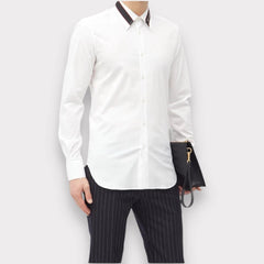 Person wearing a white dress shirt and black pinstripe pants on a plain background