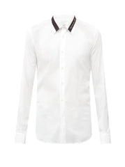 White shirt with black collar on a white background