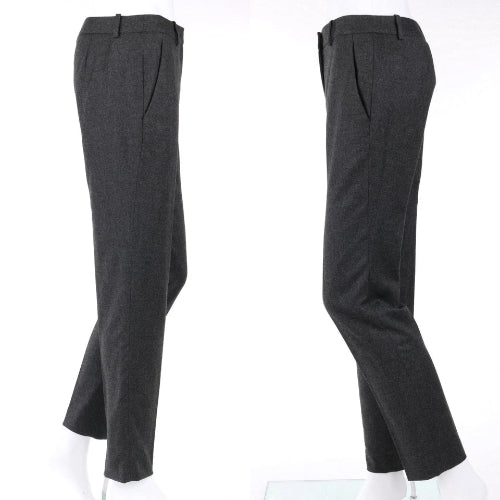 A pair of dark charcoal gray tailored trousers shown from two angles on white mannequin legs against a plain white background.