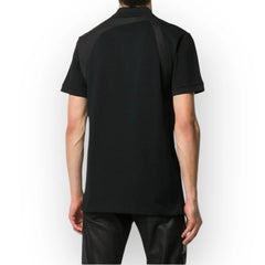Person wearing a black t-shirt on a white background