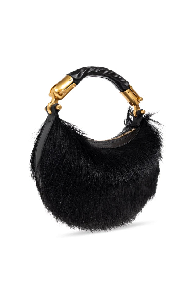 A black fur crescent handbag with a braided leather handle and gold-tone hardware, shown on a plain white background.
