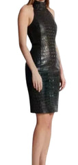 A woman wearing a sleeveless, high-neck bodycon dress with a glossy crocodile-embossed texture in black, shown against a plain light gray background.