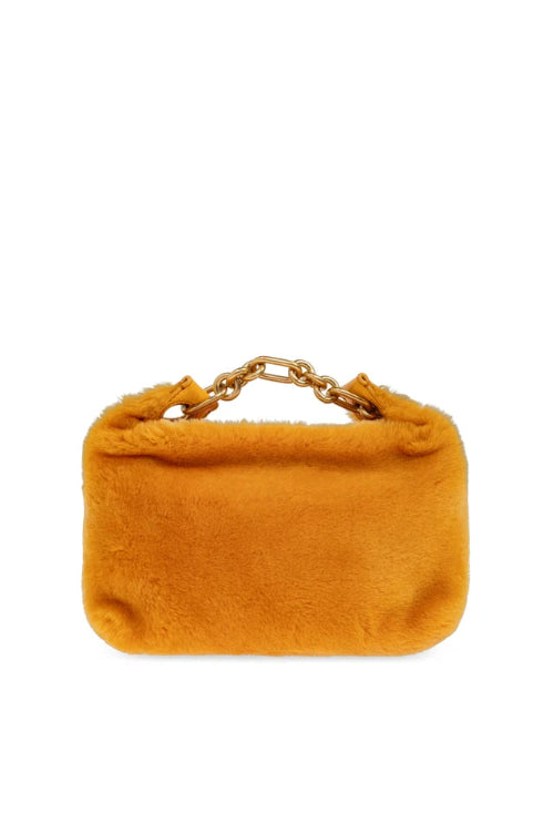 A small rectangular faux fur clutch bag in a warm mustard yellow color, featuring a gold-tone chain link handle, set against a plain white background.
