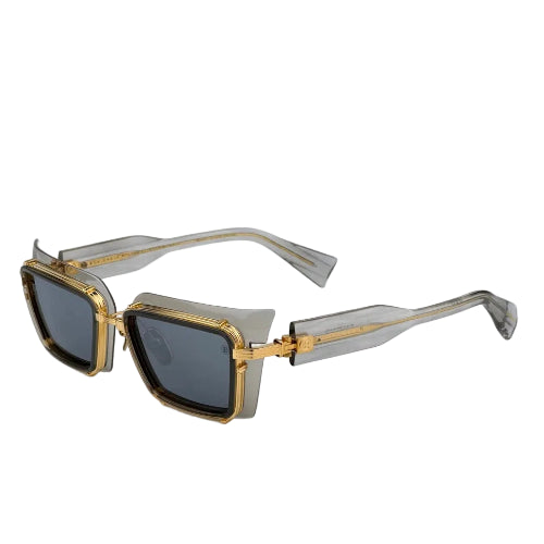 Gold-framed sunglasses on a white background