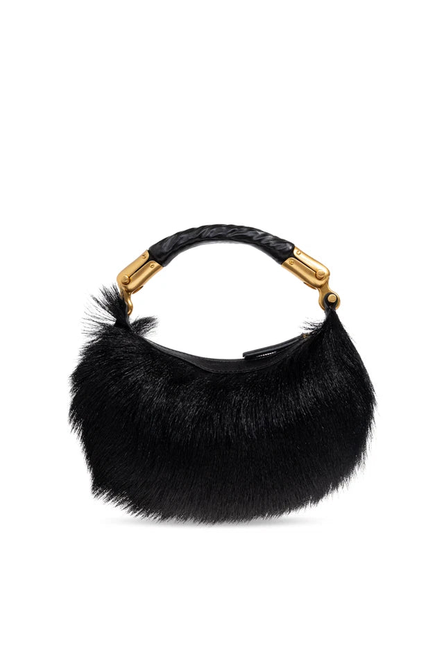 A black fur crescent shoulder bag with a braided black handle and gold-tone hardware, shown against a plain white background.