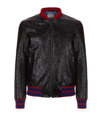 Black leather jacket with red and blue accents on a white background