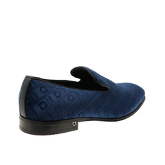 A single navy blue slip-on loafer with a textured embossed pattern, shown from a side profile view against a plain white background.