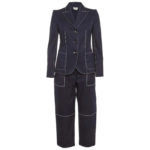 A dark navy blue two-piece suit with contrasting light gray piping details, featuring a double-breasted blazer and matching trousers, shown against a light gray background.