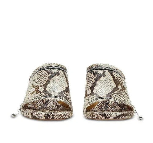 Snake skin patterned shoes on a white background