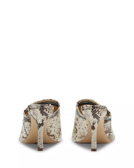 Pair of high-heeled shoes with snake print on a white background
