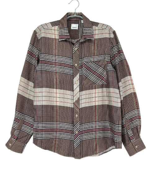 A long-sleeve plaid button-up shirt in brown, beige, and white, hanging on a hanger against a white background.