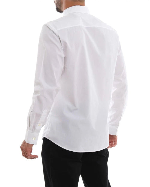 A man wearing a white long-sleeve button-down shirt, shown from the back against a plain white background.