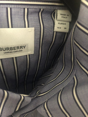 Close-up of a Burberry pinstripe fabric interior, showing the brand label sewn onto the lining.