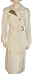 A cream-colored double-breasted trench coat with a waist belt, shown on a mannequin against a plain white background.