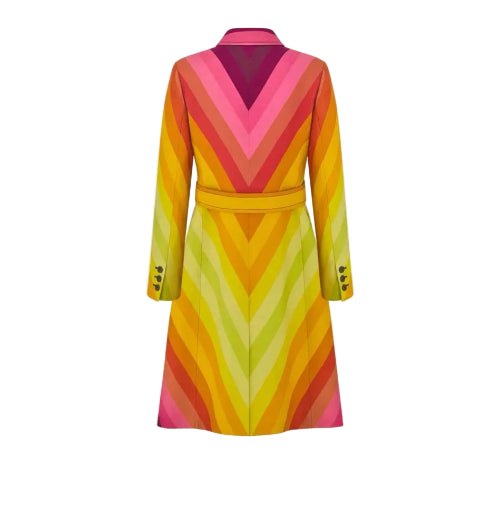 A long-sleeve belted coat with a vibrant chevron pattern in shades of yellow, orange, pink, and green, shown from the back on a light gray background.