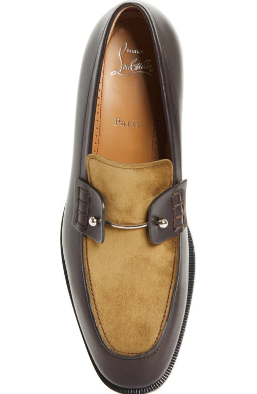 A single men's loafer shown from a top-down angle on a plain white background. The shoe features a dark brown leather toe cap and a tan suede vamp with a small center tab.