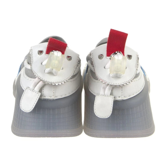 A pair of white and gray baby shoes designed to look like cartoon chicken feet, featuring red accents on the heels and white plastic claws.