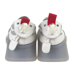 A pair of white and gray baby shoes designed to look like cartoon chicken feet, featuring red accents on the heels and white plastic claws.