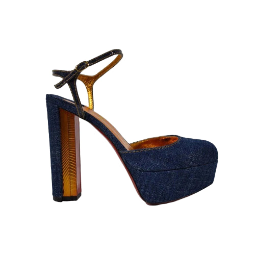 Blue denim high-heeled shoe with a platform on a white background