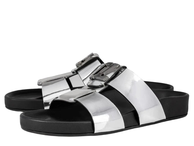 Silver and black sandals with metallic buckle on a white background